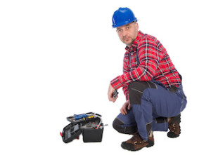 Plumber worker isolated on white